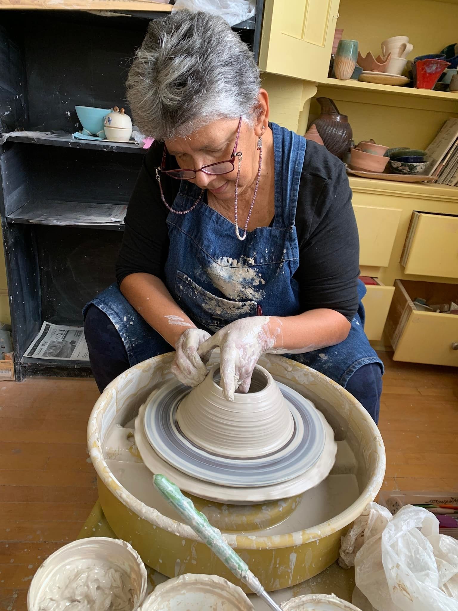 Woman working on a pottery wheel