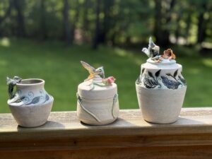 A set of three beautiful hummingbird themed vessels