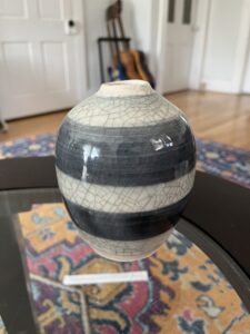 A mesmerizing dark grey and white striped bud vase. The white striping is made up from a crackle glaze and finished with India Ink to reveal the beautiful cracle effect