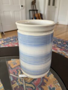 A light blue and white striped tumbler by Rosie. Check out that rim!